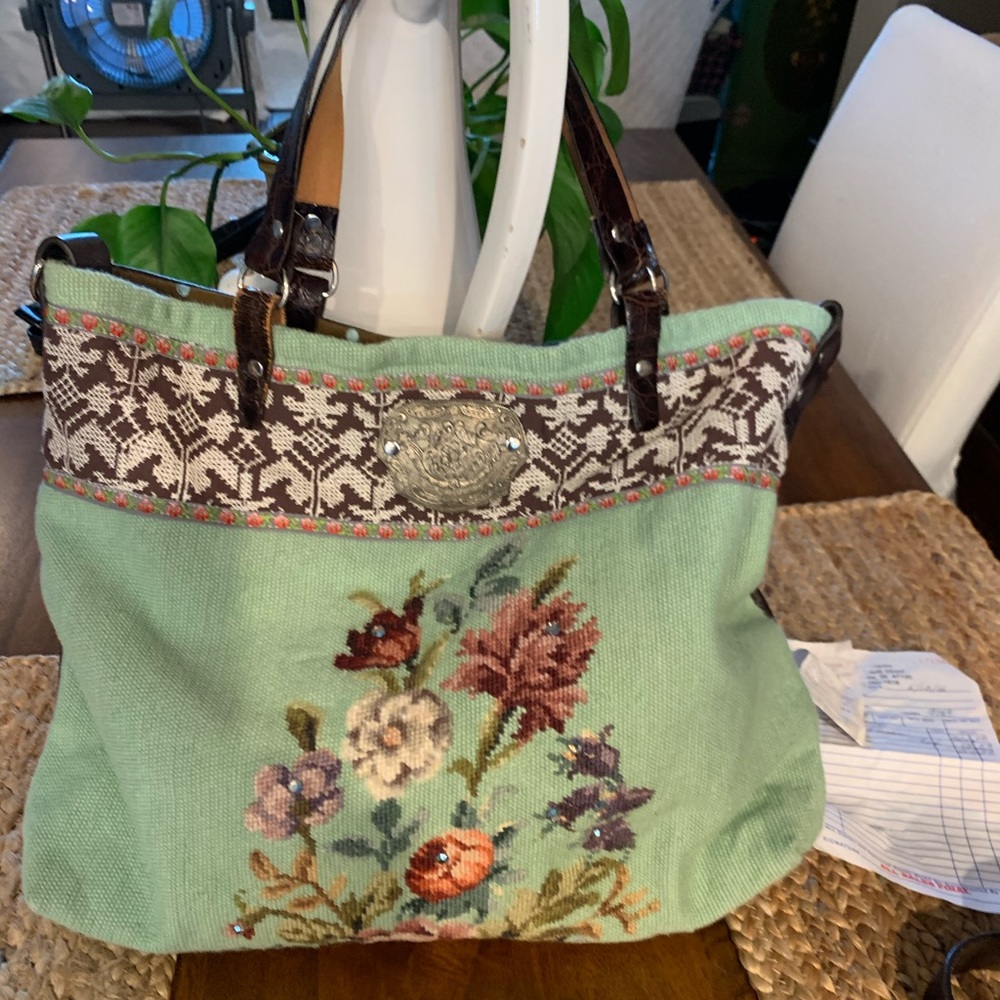 This is a handmade “Melody Elizabeth” handbag.